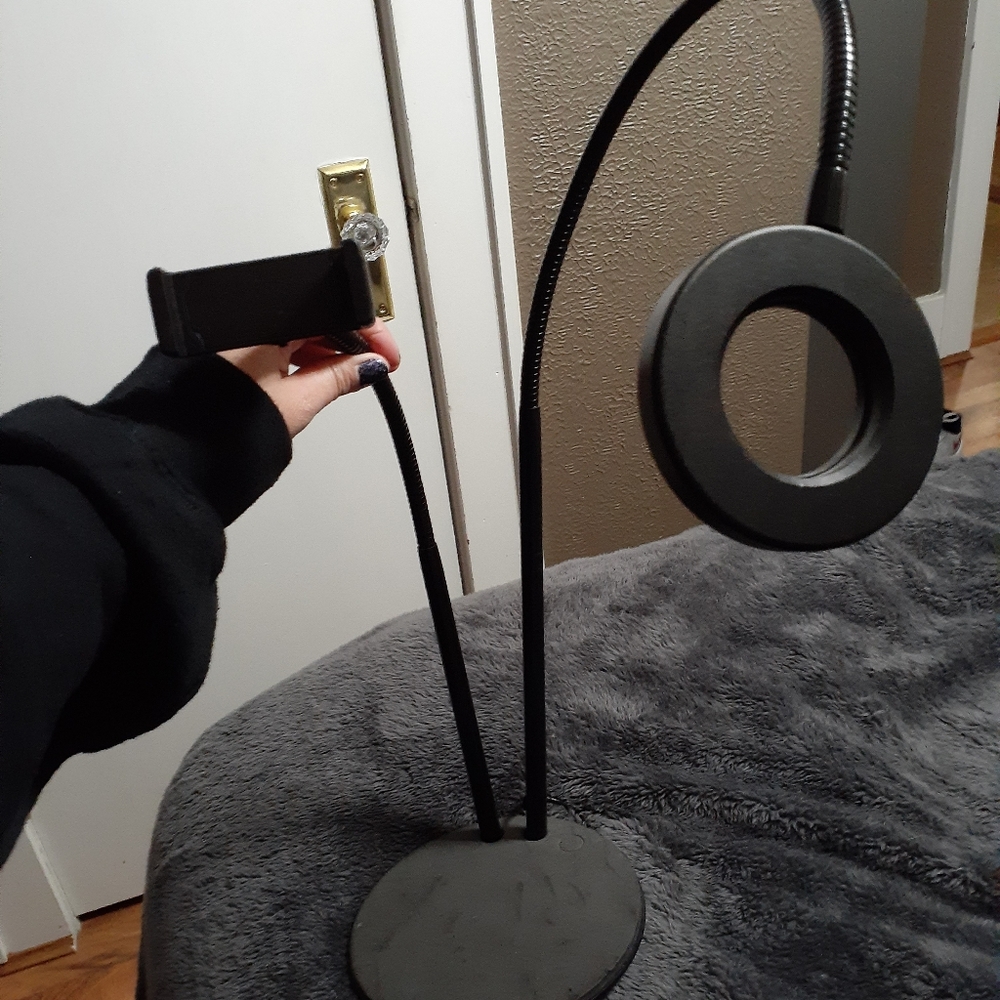 Cell phone holder with light